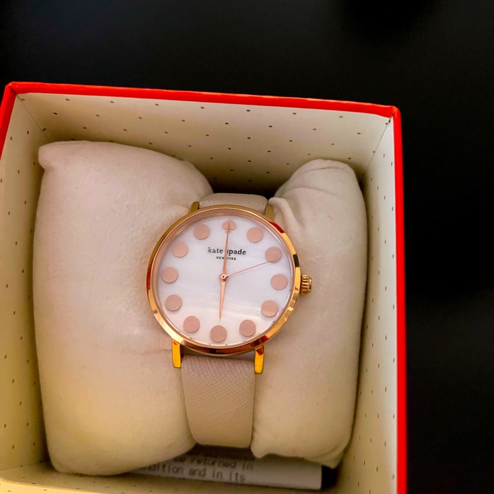 Kate Spade watch. Rose gold and tan. Perfect condition. Only worn once.